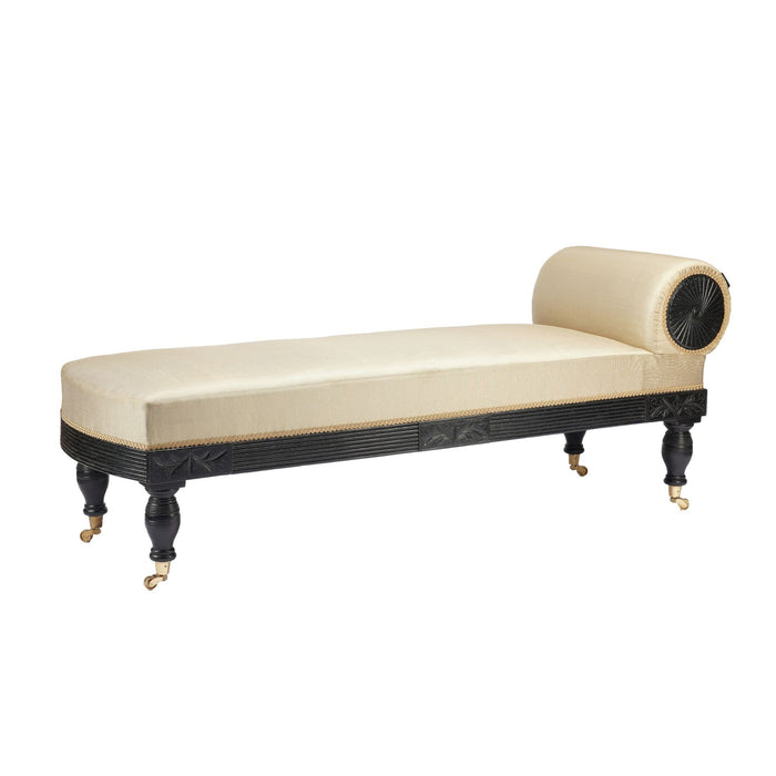 American Eastlake upholstered chaise in ebonized walnut with brass casters (1888)