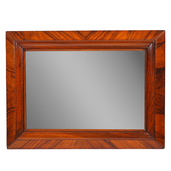 Continental cross banded walnut mirror (c. 1825)