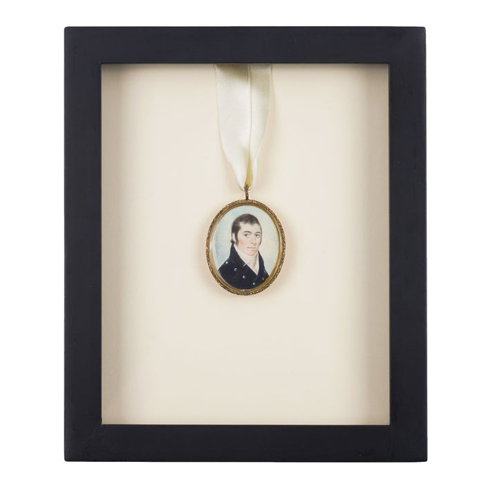 New England gentleman's portrait on a bone pendant in a gilt bezel (c. 1810)