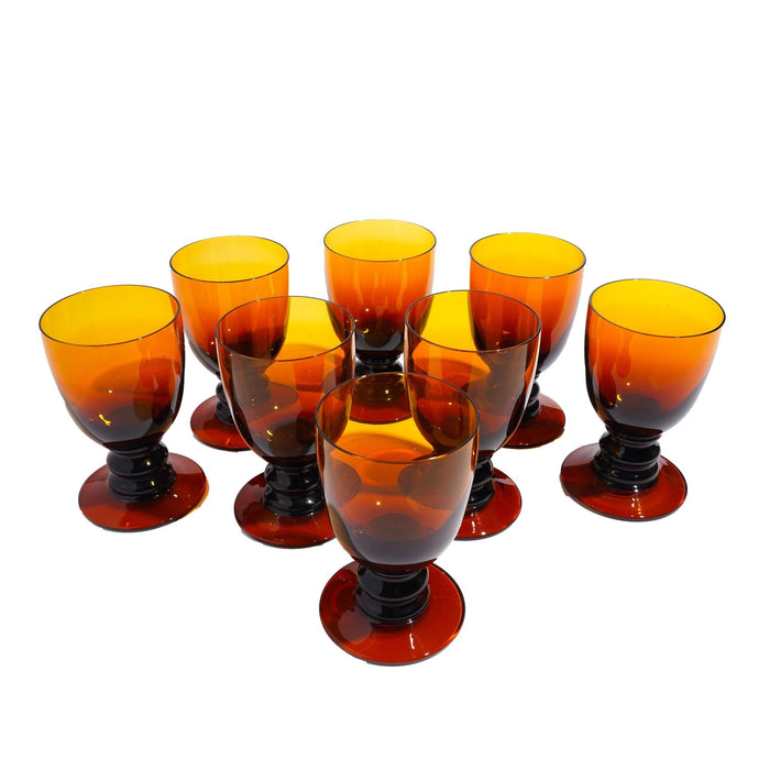 Set of eight amber glass pedestal rummers (c. 1950)
