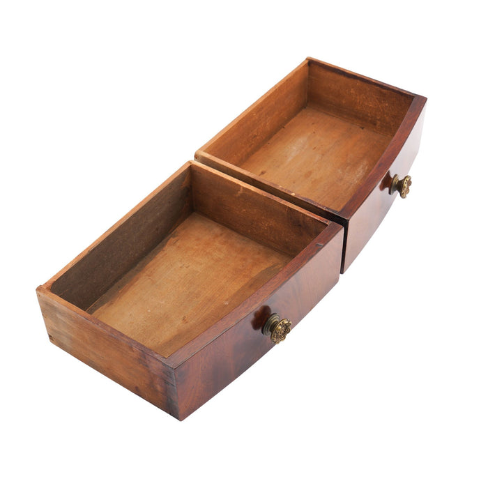 Rectangular mahogany dressing mirror on a bow front stand with drawer (c. 1790)