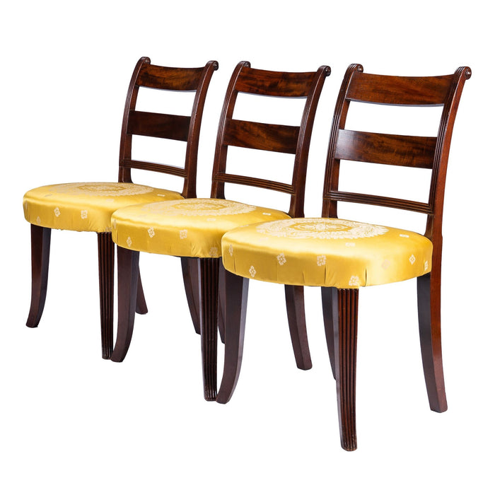 Set of three American upholstered seat mahogany side chairs (c. 1800-1810)
