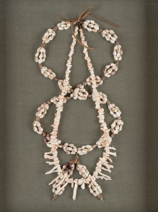 Shell and white branch coral necklaces mounted in a custom shadowbox