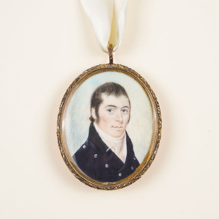 New England gentleman's portrait on a bone pendant in a gilt bezel (c. 1810)