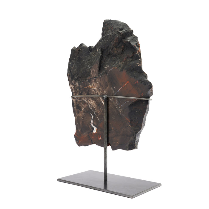 Geological specimen of Southwestern American petrified wood on stand