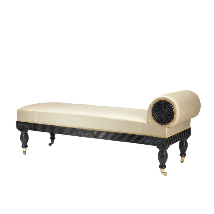 American Eastlake upholstered chaise in ebonized walnut with brass casters (1888)