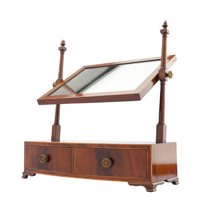 Rectangular mahogany dressing mirror on a bow front stand with drawer (c. 1790)