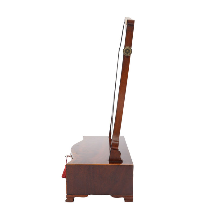 George lIl mahogany swinger shield dressing mirror on a serpentine box stand (c. 1790)