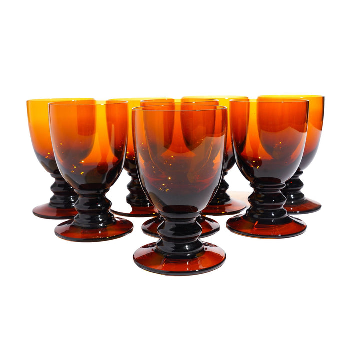 Set of eight amber glass pedestal rummers (c. 1950)