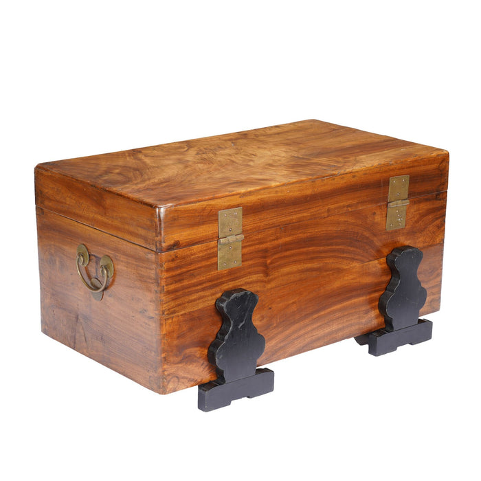 Chinese camphor wood trunk on ebonized hardwood stand (c. 1820)