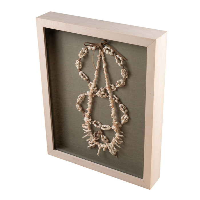 Shell and white branch coral necklaces mounted in a custom shadowbox