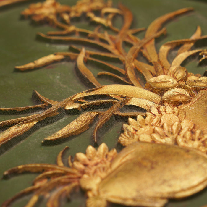 Chinese wood panel with a shallow carved and gilt cartouche on a red lacquer ground (1800's)