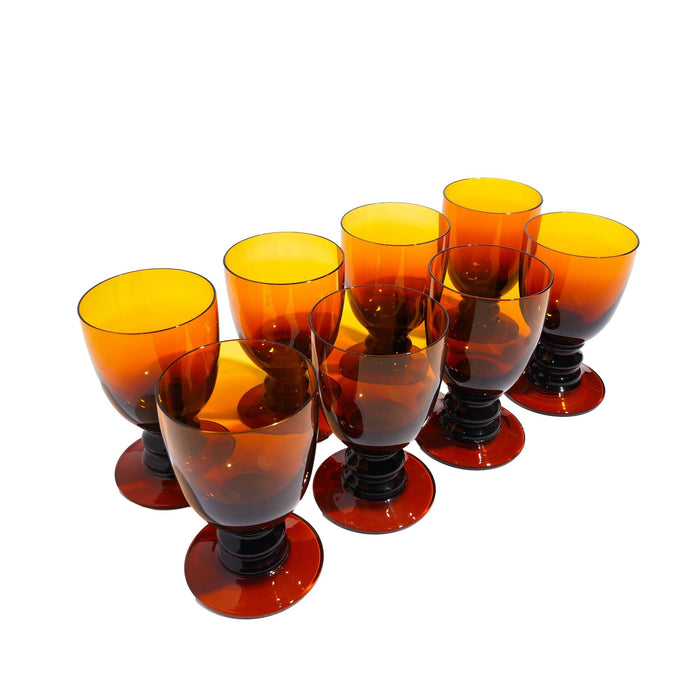 Set of eight amber glass pedestal rummers (c. 1950)