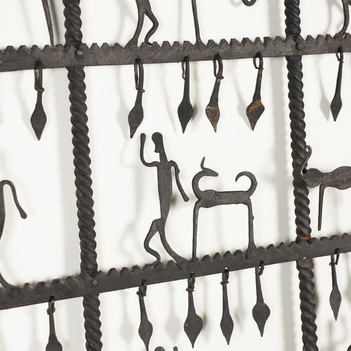 Dogon tribal hand forged rope twist iron window pane grill with figures (1900-25)