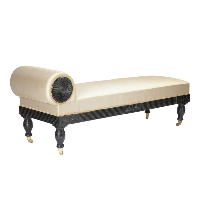 American Eastlake upholstered chaise in ebonized walnut with brass casters (1888)