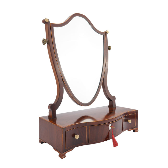 George lIl mahogany swinger shield dressing mirror on a serpentine box stand (c. 1790)