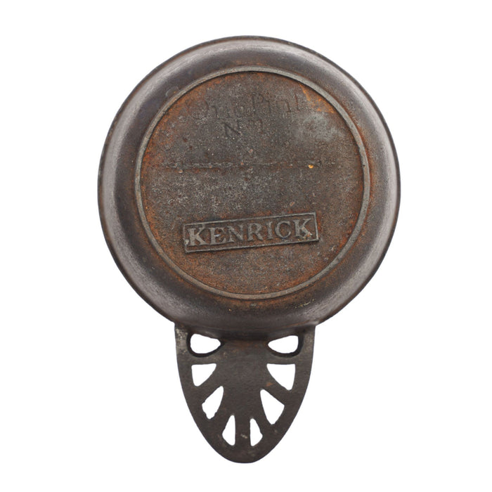 Two graduated cast iron porringers by Kenrick Iron Mongers (1790-1830)