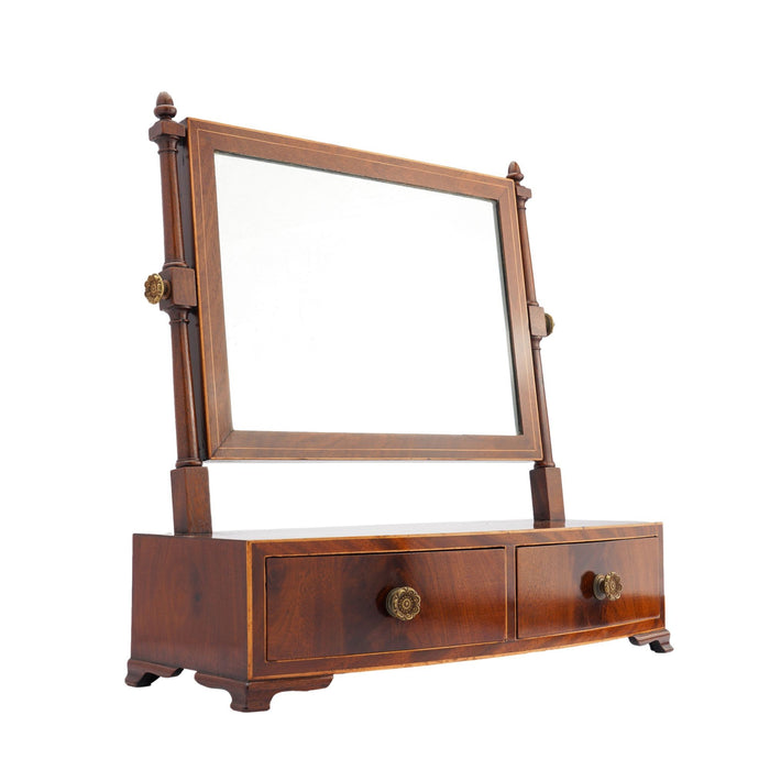 Rectangular mahogany dressing mirror on a bow front stand with drawer (c. 1790)