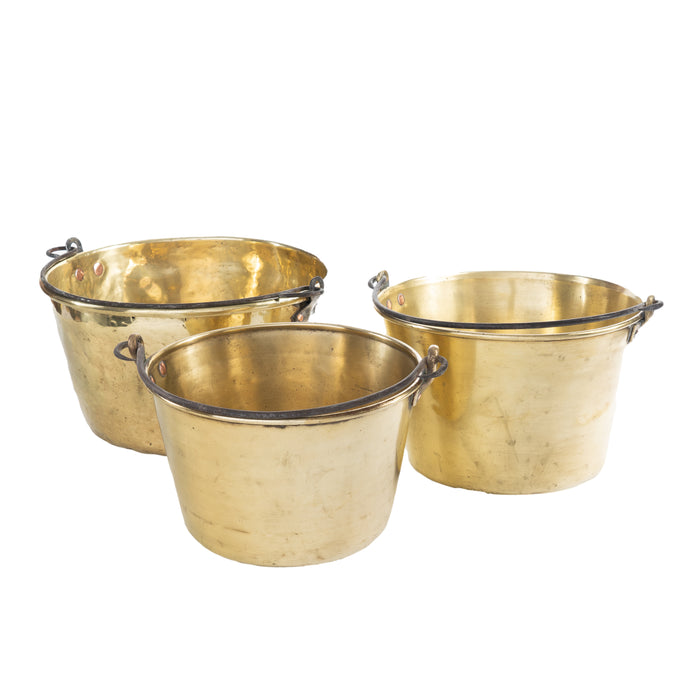 Assembled set of 3 spun brass kettles with steel wire handles (c. 1875)