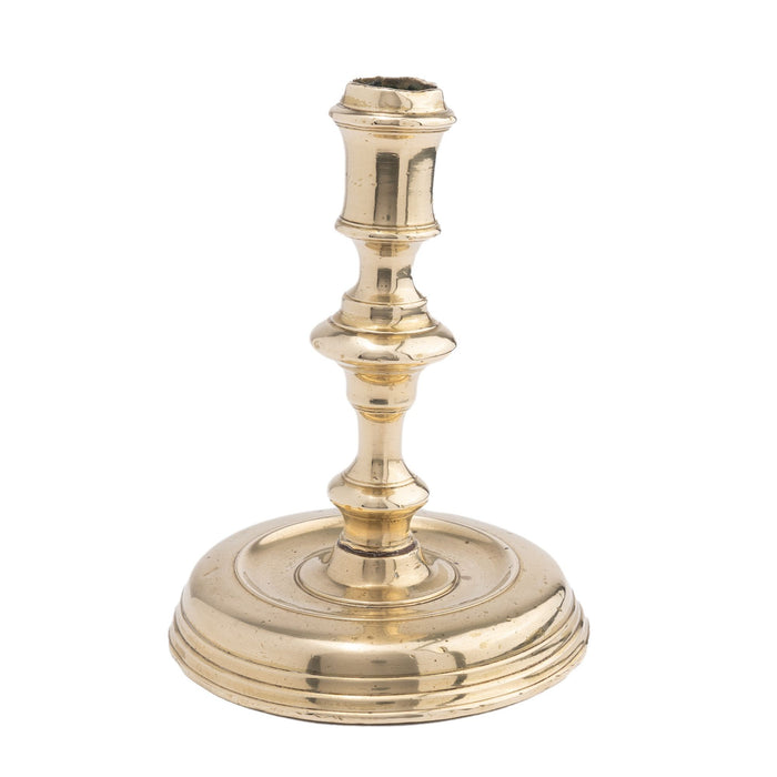 French cast brass circular base candlestick (c. 1720)