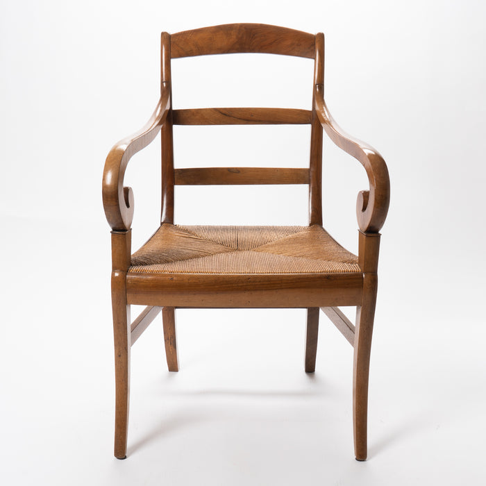 French cherry wood arm chair with rush seat and upholstered seat cushion (c. 1830)