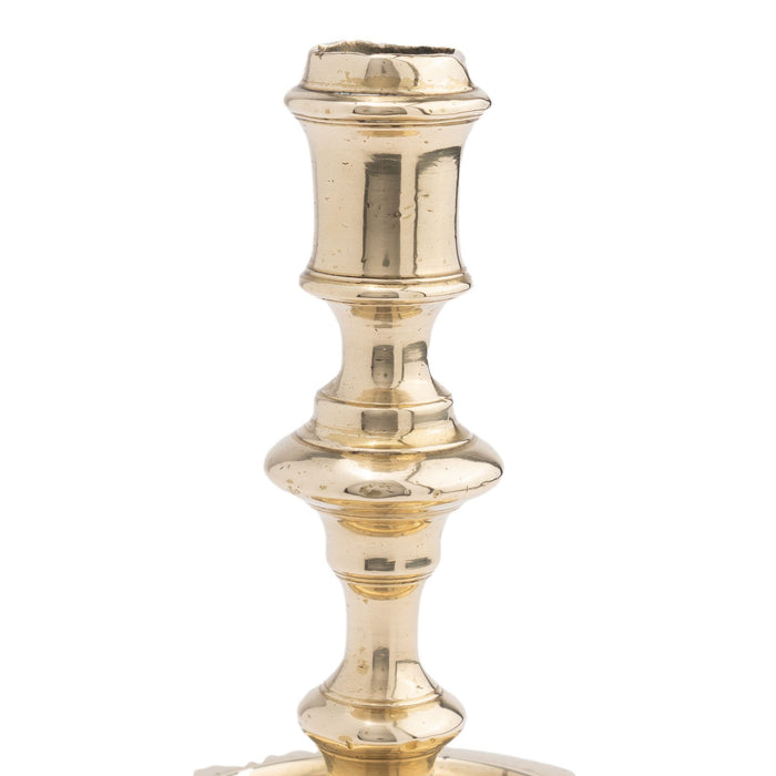 French cast brass circular base candlestick (c. 1720)