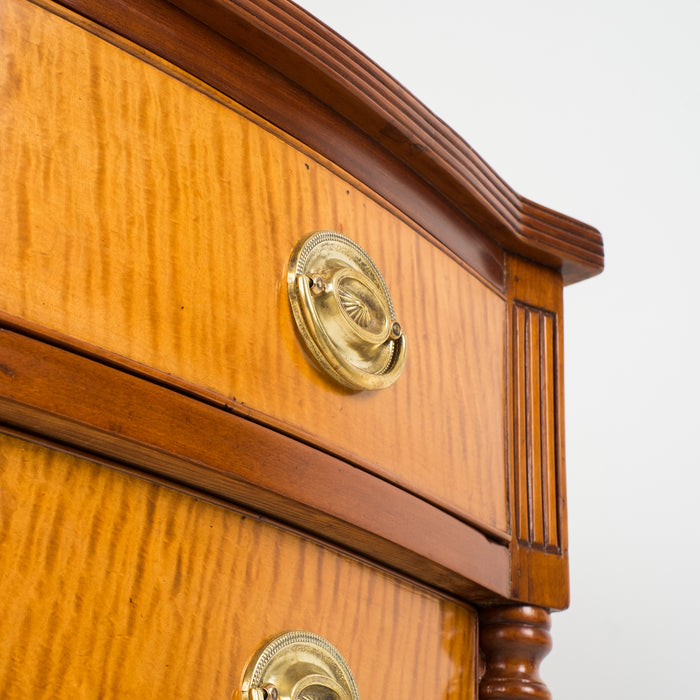 American Sheraton cherry and curly maple four drawer bow front chest (c. 1815)