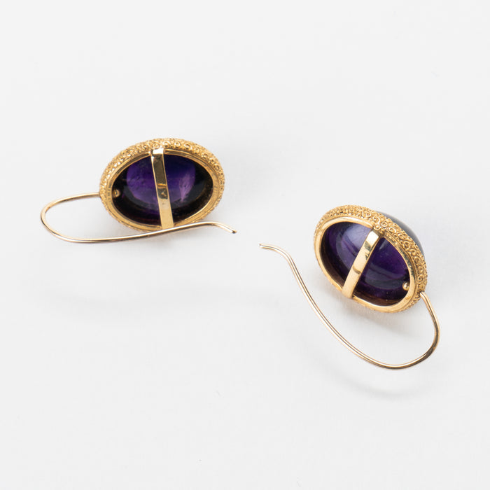 Pair of English cabochon amethyst earrings set in 14k gold engraved bezel (c. 1880)