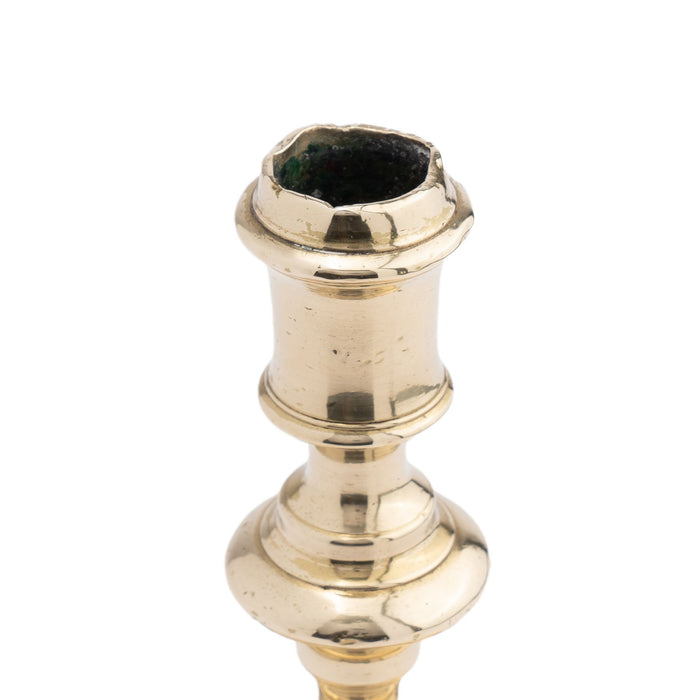 French cast brass circular base candlestick (c. 1720)