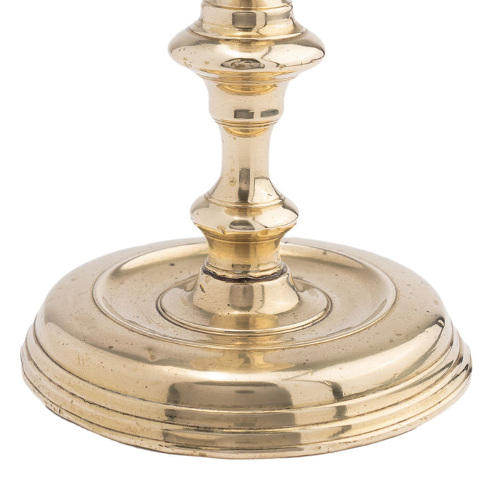 French cast brass circular base candlestick (c. 1720)