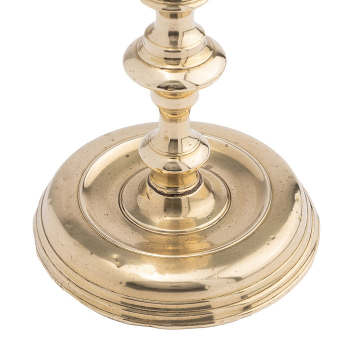 French cast brass circular base candlestick (c. 1720)