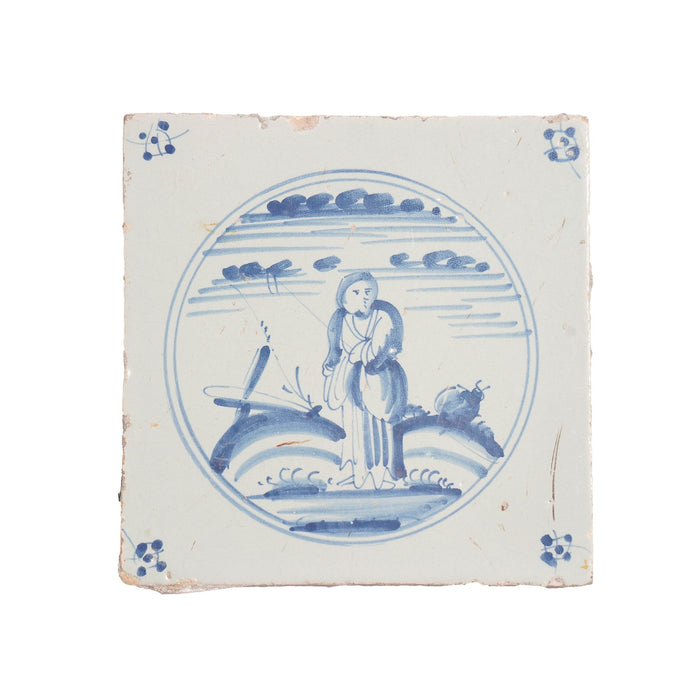 Delft faience tile of a girl in a landscape (c. 1700’s)