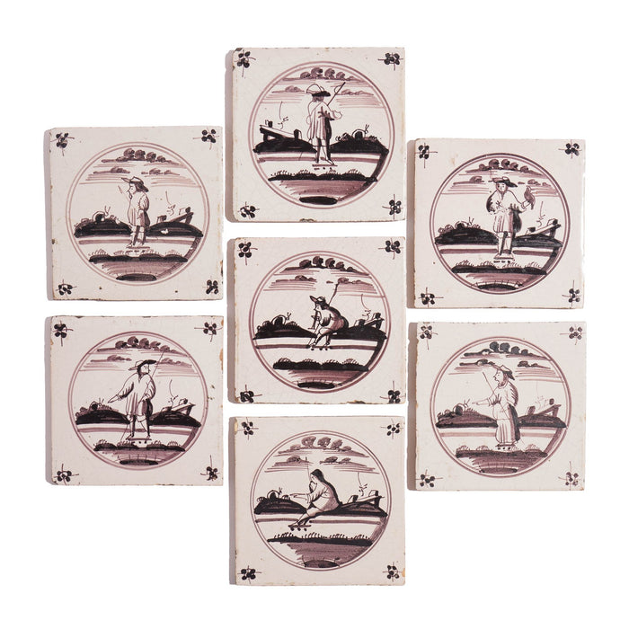 Set of 7 mulberry decorated figural Delft faience tiles (c. 1680-1700)