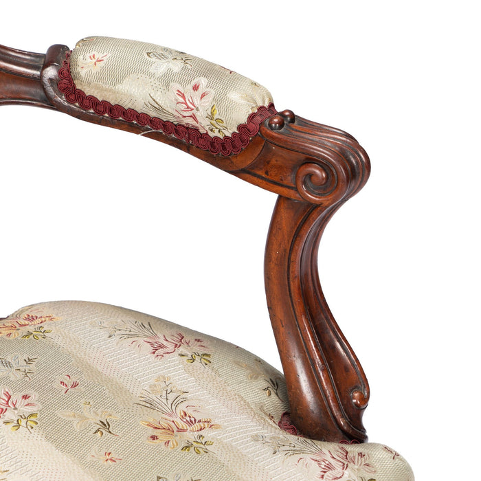 French Louis Philippe Period upholstered walnut arm chair with paired footstool (1850's)