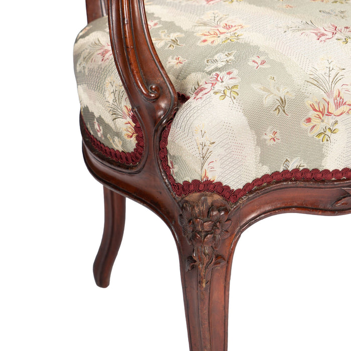 French Louis Philippe Period upholstered walnut arm chair with paired footstool (1850's)