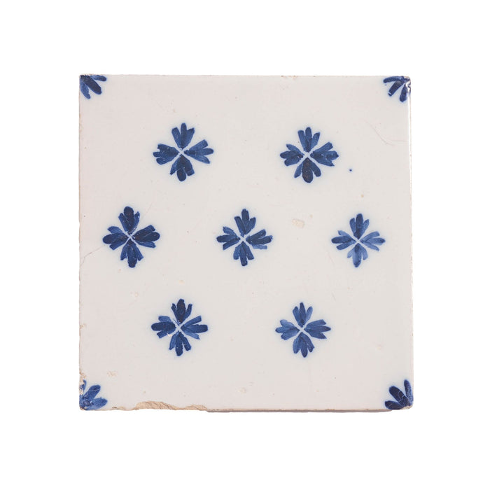 Set of 9 Delft tiles in cobalt pattern of florets (c. 1600’s)