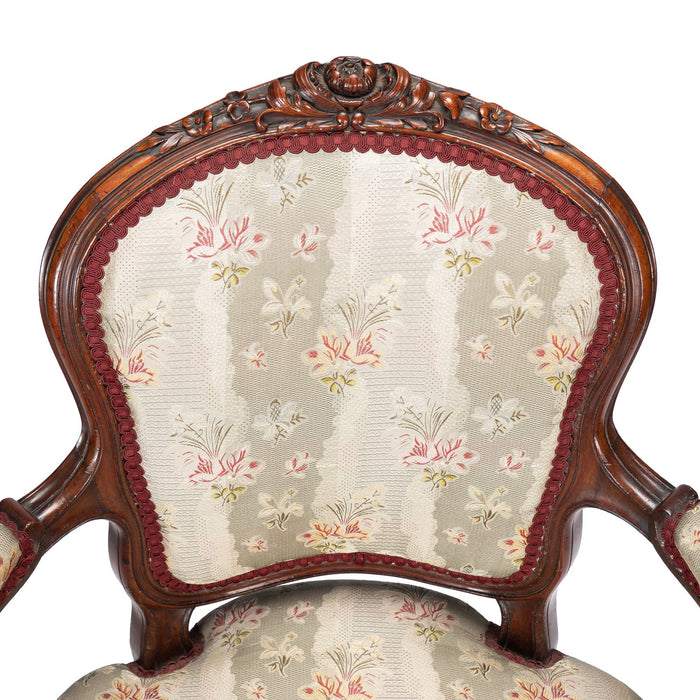 French Louis Philippe Period upholstered walnut arm chair with paired footstool (1850's)