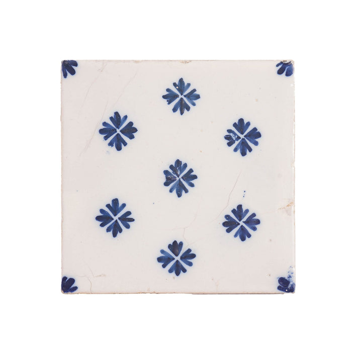 Set of 9 Delft tiles in cobalt pattern of florets (c. 1600’s)