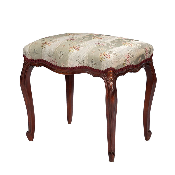 French Louis Philippe Period upholstered walnut arm chair with paired footstool (1850's)