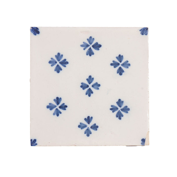 Set of 9 Delft tiles in cobalt pattern of florets (c. 1600’s)