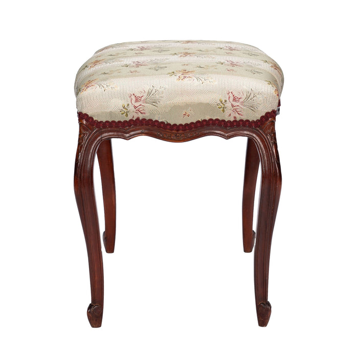 French Louis Philippe Period upholstered walnut arm chair with paired footstool (1850's)