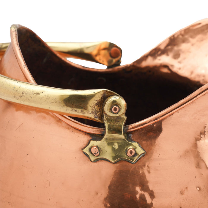 Helmet shaped copper coal hod on a circular footed base (1800's)