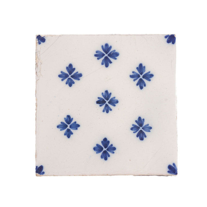 Set of 9 Delft tiles in cobalt pattern of florets (c. 1600’s)