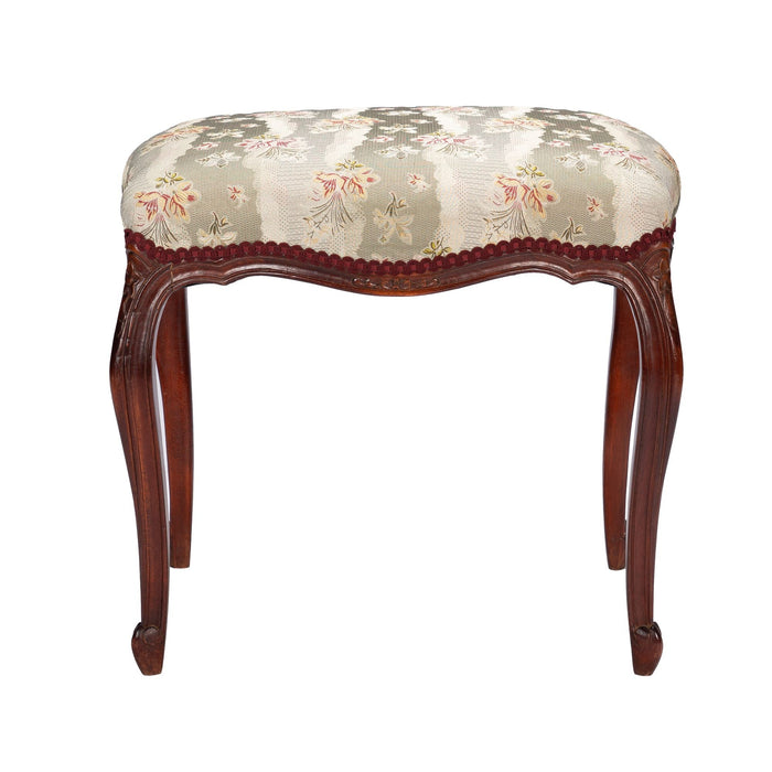 French Louis Philippe Period upholstered walnut arm chair with paired footstool (1850's)