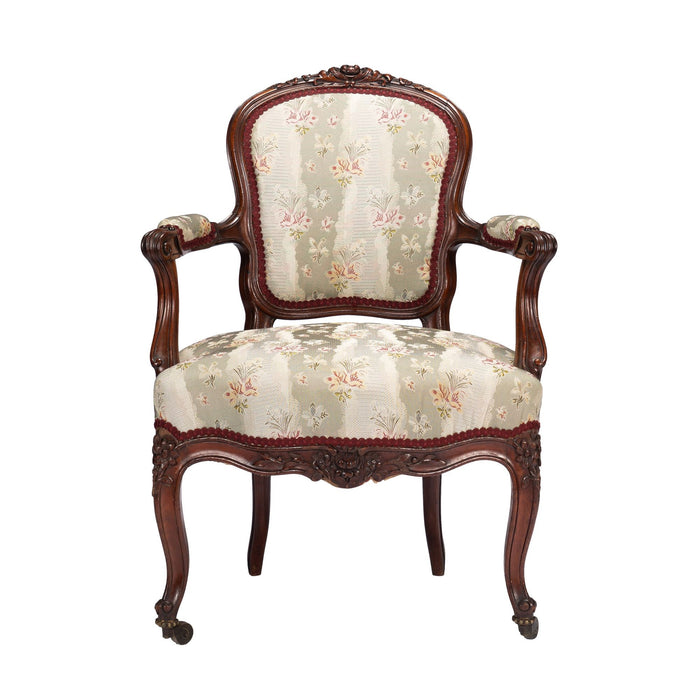 French Louis Philippe Period upholstered walnut arm chair with paired footstool (1850's)