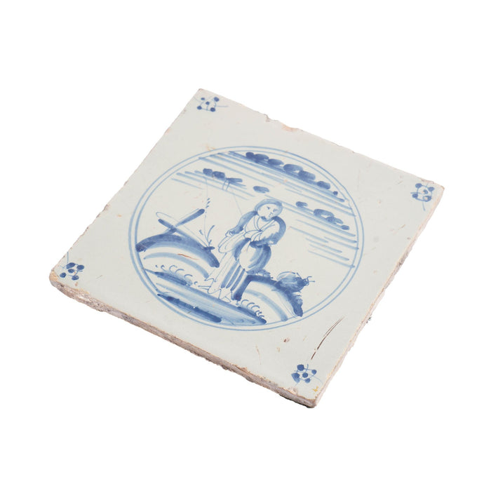 Delft faience tile of a girl in a landscape (c. 1700’s)