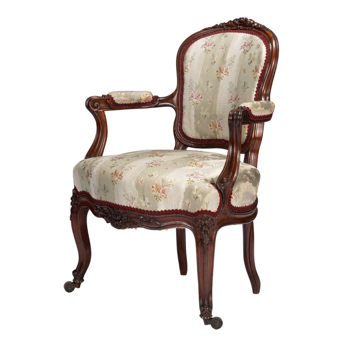 French Louis Philippe Period upholstered walnut arm chair with paired footstool (1850's)