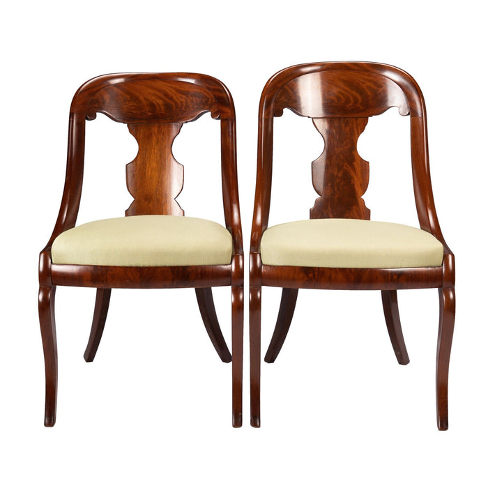 Pair of American mahogany gondola chairs (c. 1815-35)