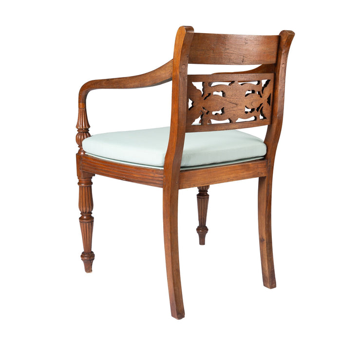 Anglo-Indian teak arm chair with caned seat and cushion (1900-50)