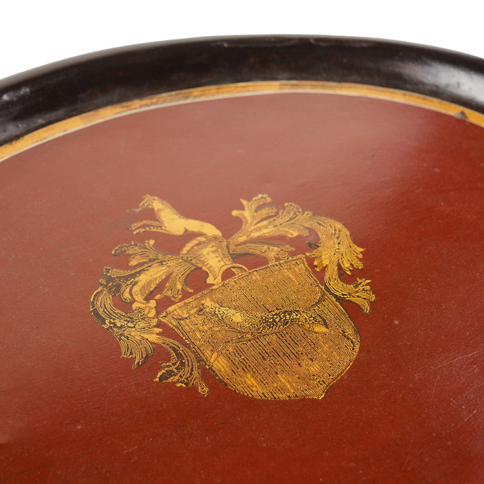 Continental oval tole tea tray with gilt armorial (1825-50)